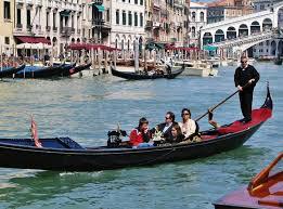 Gondola ride through the canals of Venice - Photo 4