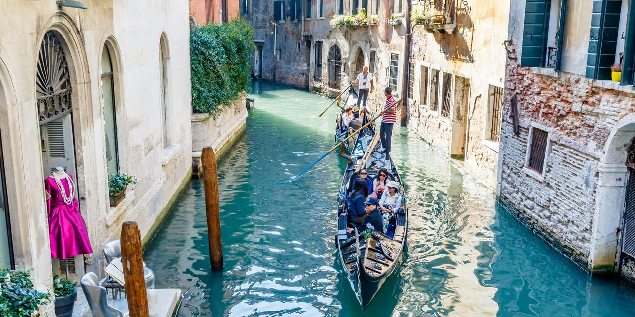 Gondola ride through the canals of Venice - Photo 14